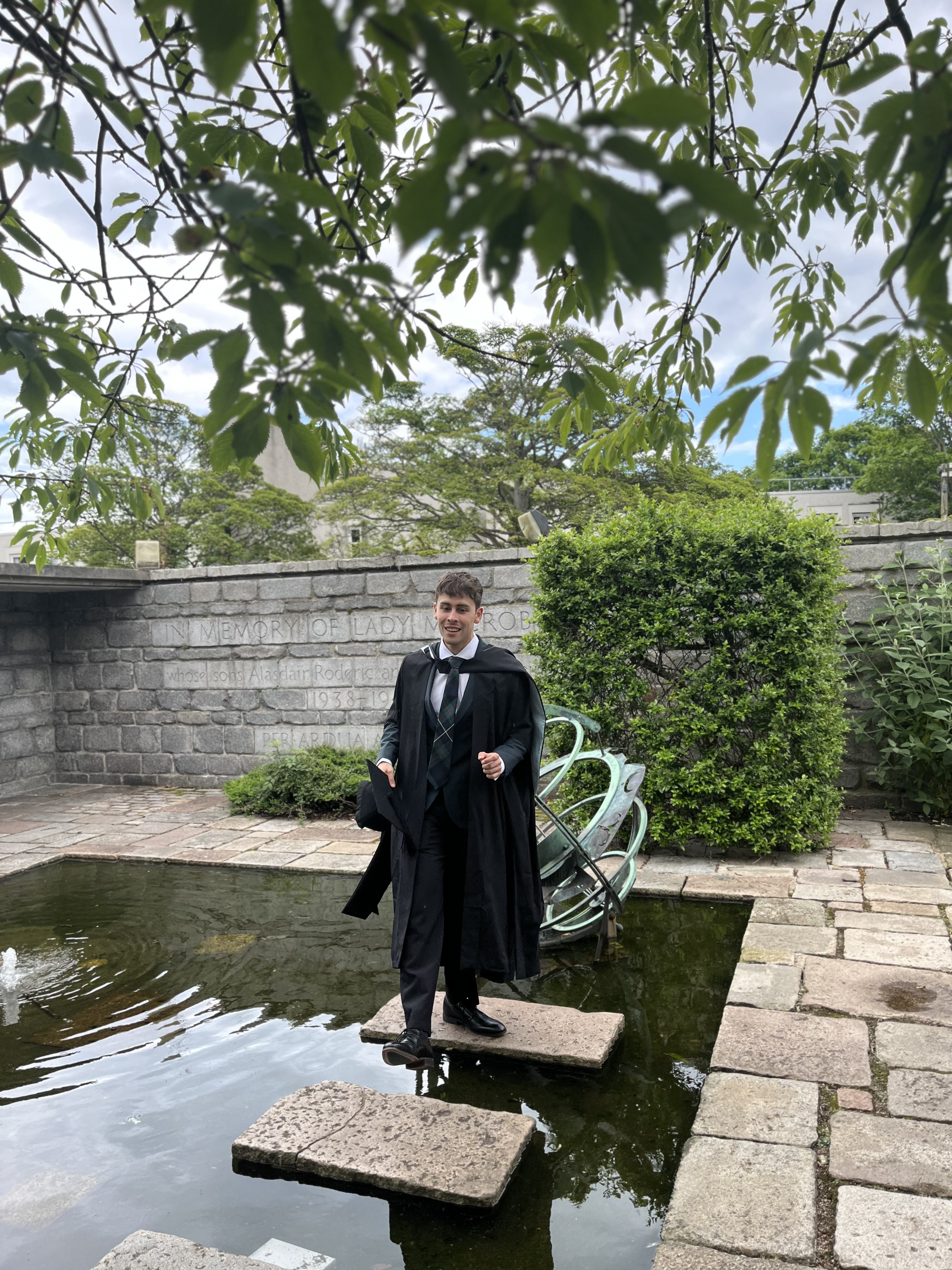 Photo of Ian graduating